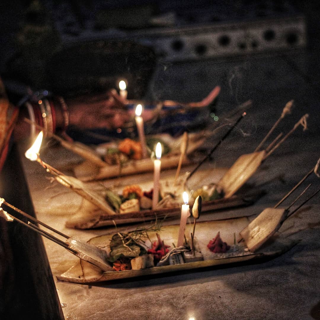 Boats made of banana leaves with lighted candles